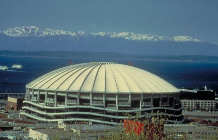 The Kingdome on the Seattle waterfront with the Olympic Mountains beyond